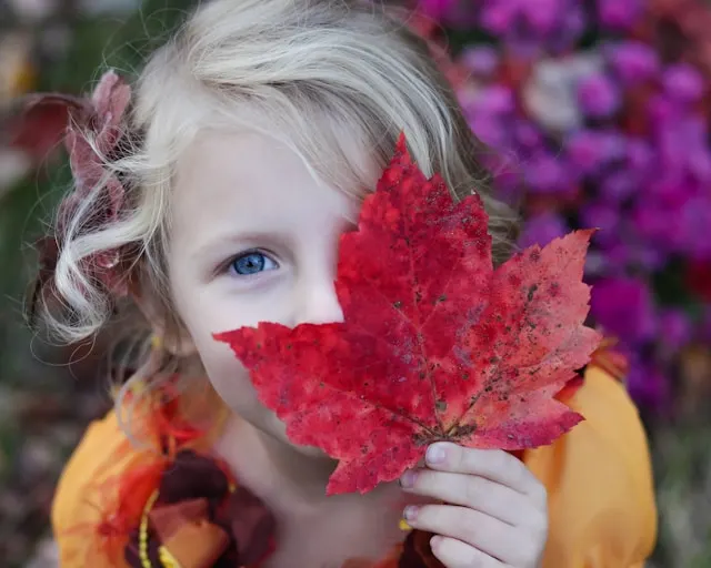 girl with autumn leaf